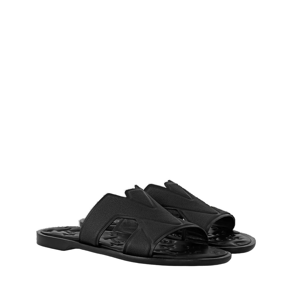 mules Louis Vuitton Oasis en cuir grainé noir présentent un motif LV entrelacé sur la bride