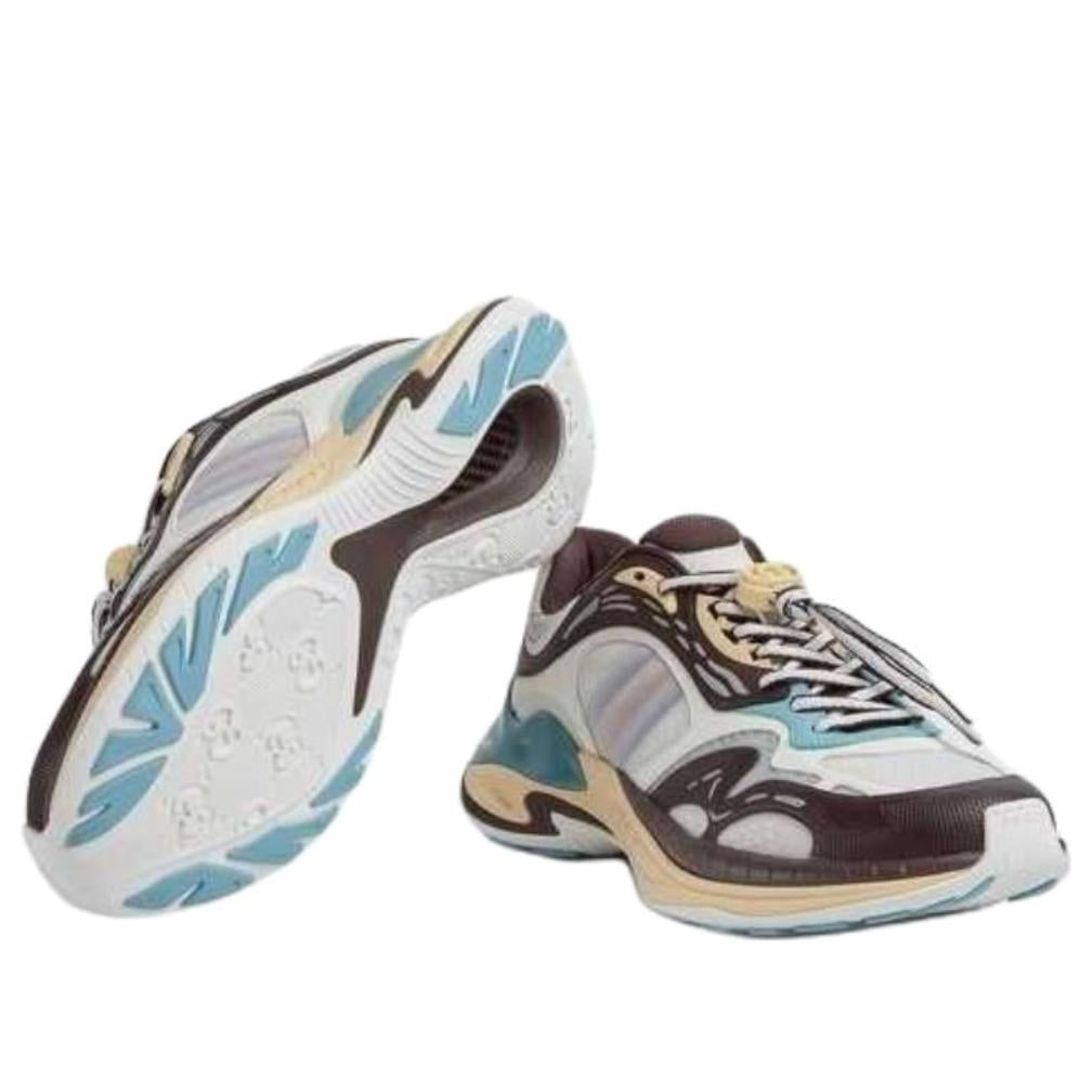 Baskets Gucci 2.0 dans un coloris blanc, marron et bleu clair.