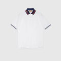 polo blanc en piqué de coton de Gucci se distingue particulièrement par son col rayé rouge et bleu rehaussé de la signature de la marque Gucci Web-collar Piqué Polo Shirt.