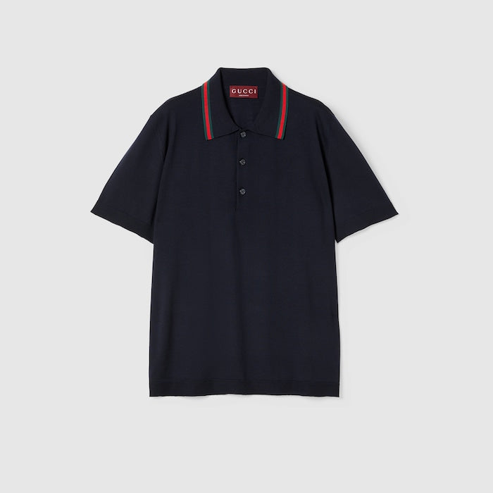 Polo en maille de laine avec bande Web de la maison Gucci, proposé dans un coloris bleu foncé (ou bleu marine).